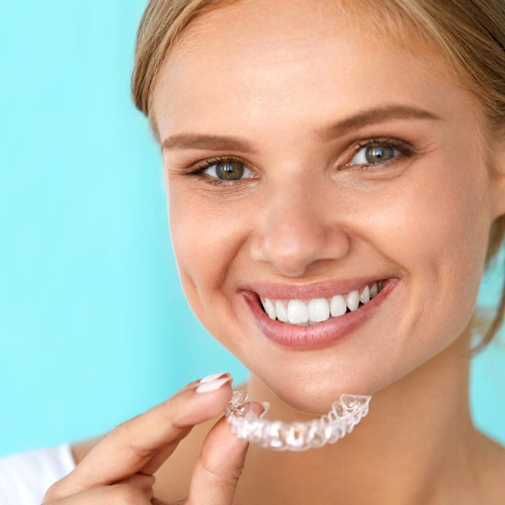 woman wearing clear aligners