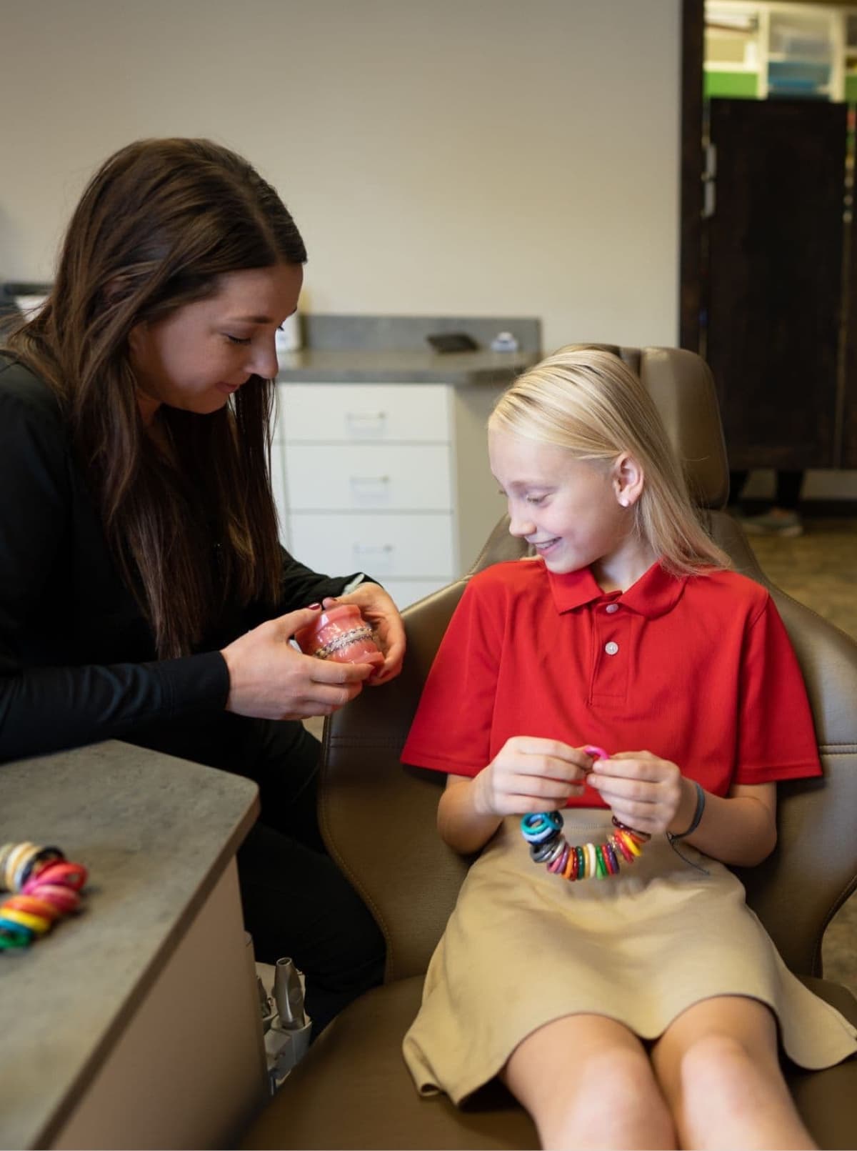 young patient smiling with team member